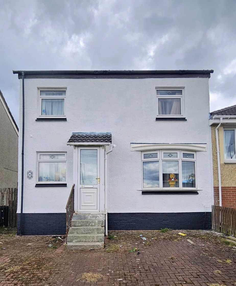 Exterior wall coating — freshly coated white roughcast home by Rocksteady